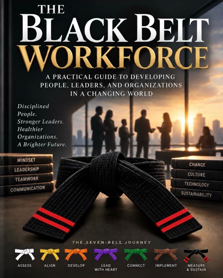 Cover of The Black Belt Workforce, showing a black belt with red stripes over stacks of labeled books with businesspeople silhouetted before a city at sunset